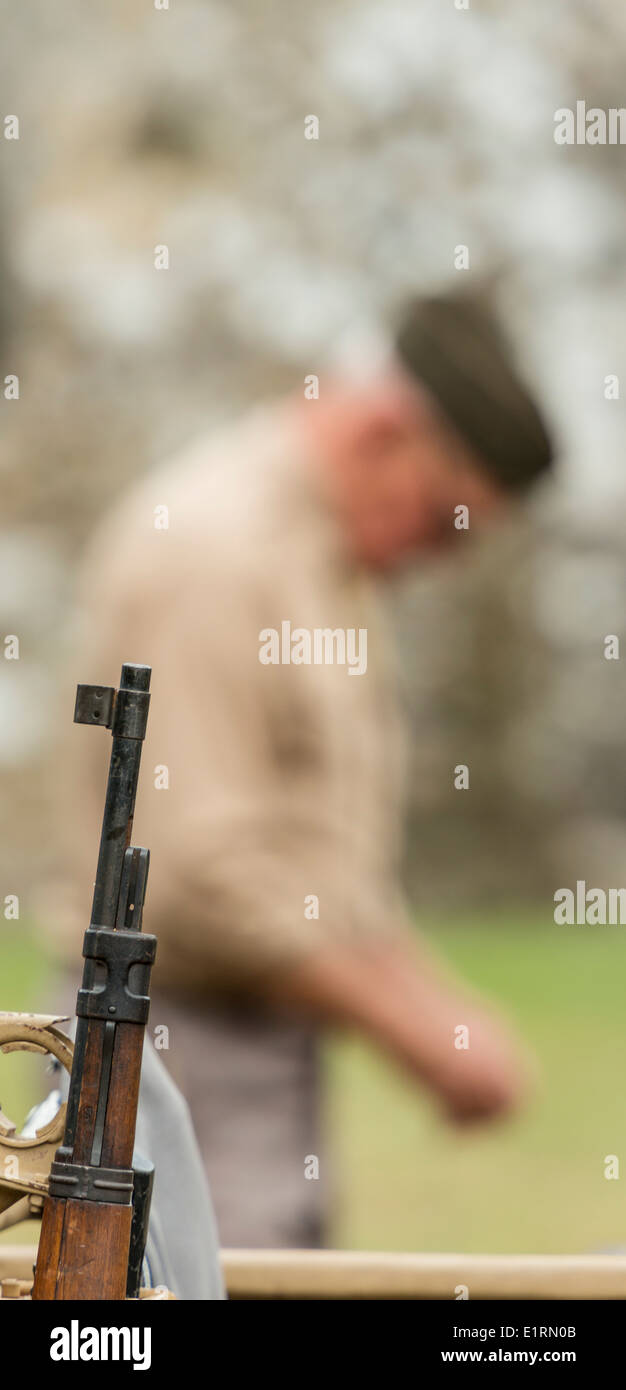 Man dressed as a World War 2 American serviceman bows his head in prayer Stock Photo