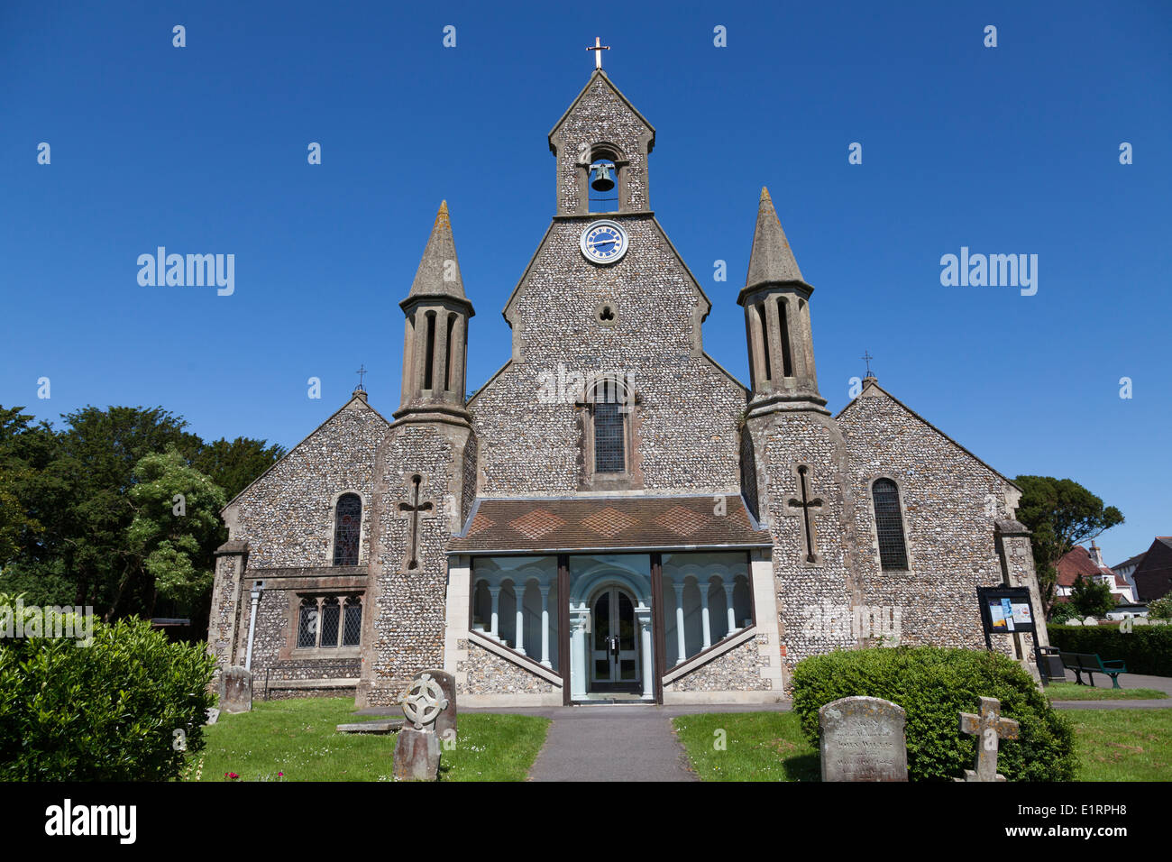 Flint stone built St James Church Emsworth with bell gable and covered porch. Stock Photo
