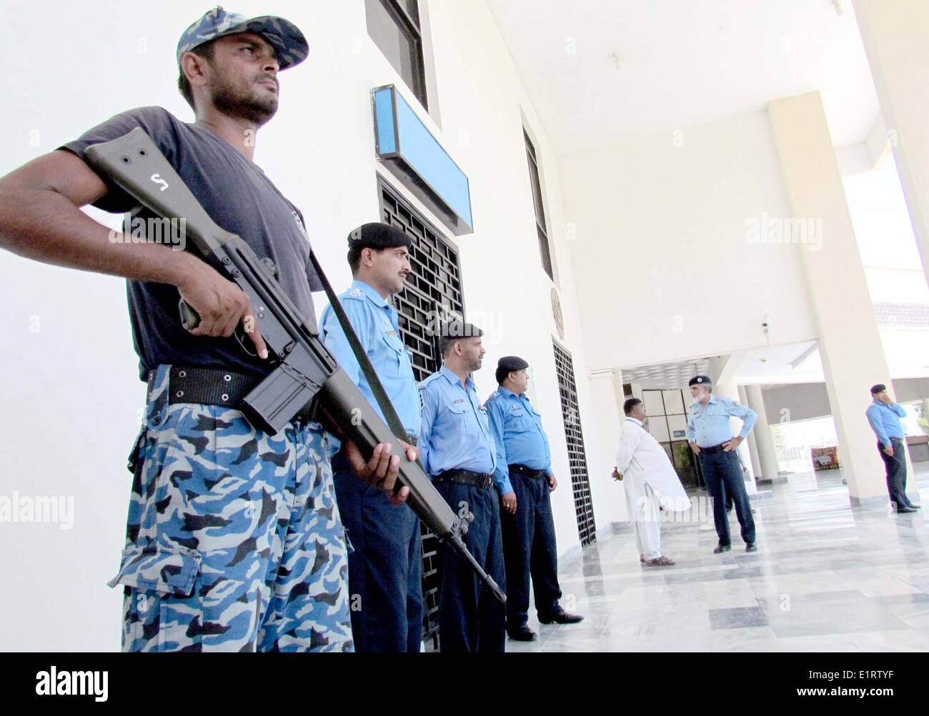 View of security arrangements at Sukkur Airport, after militants launched assault at Jinnah International Airport in Karachi on last night, on Monday, June 09, 2014. Several flights were cancelled due to late night terrorist attack on Karachi airport which left 19 people dead and at least 25 injured, Two Karachi-bound flights from Islamabad were canceled. Incoming flights were diverted to Sukkur, Nawabshah and Quetta as Civil Aviation Authority (CAA) said operations are suspended until further notice. All flights for UAE, Kuwait, Saudi Arabia, Amman and UK. Stock Photo