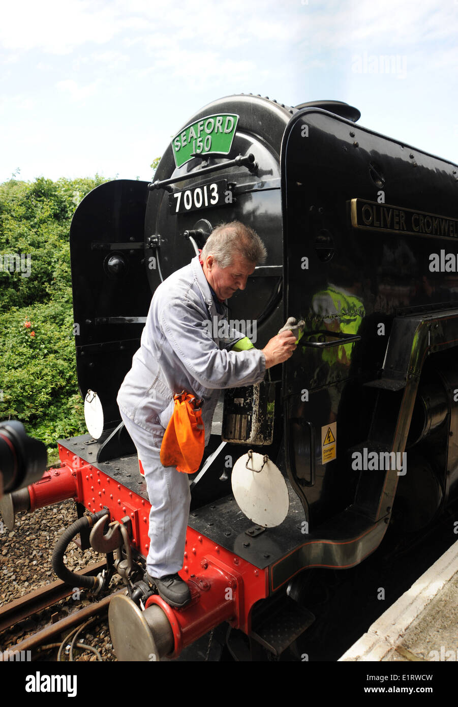 The Oliver Cromwell a Britannia class 'Pacific' steam locomotive is given a clean after visiting Seaford station Sussex UK Stock Photo