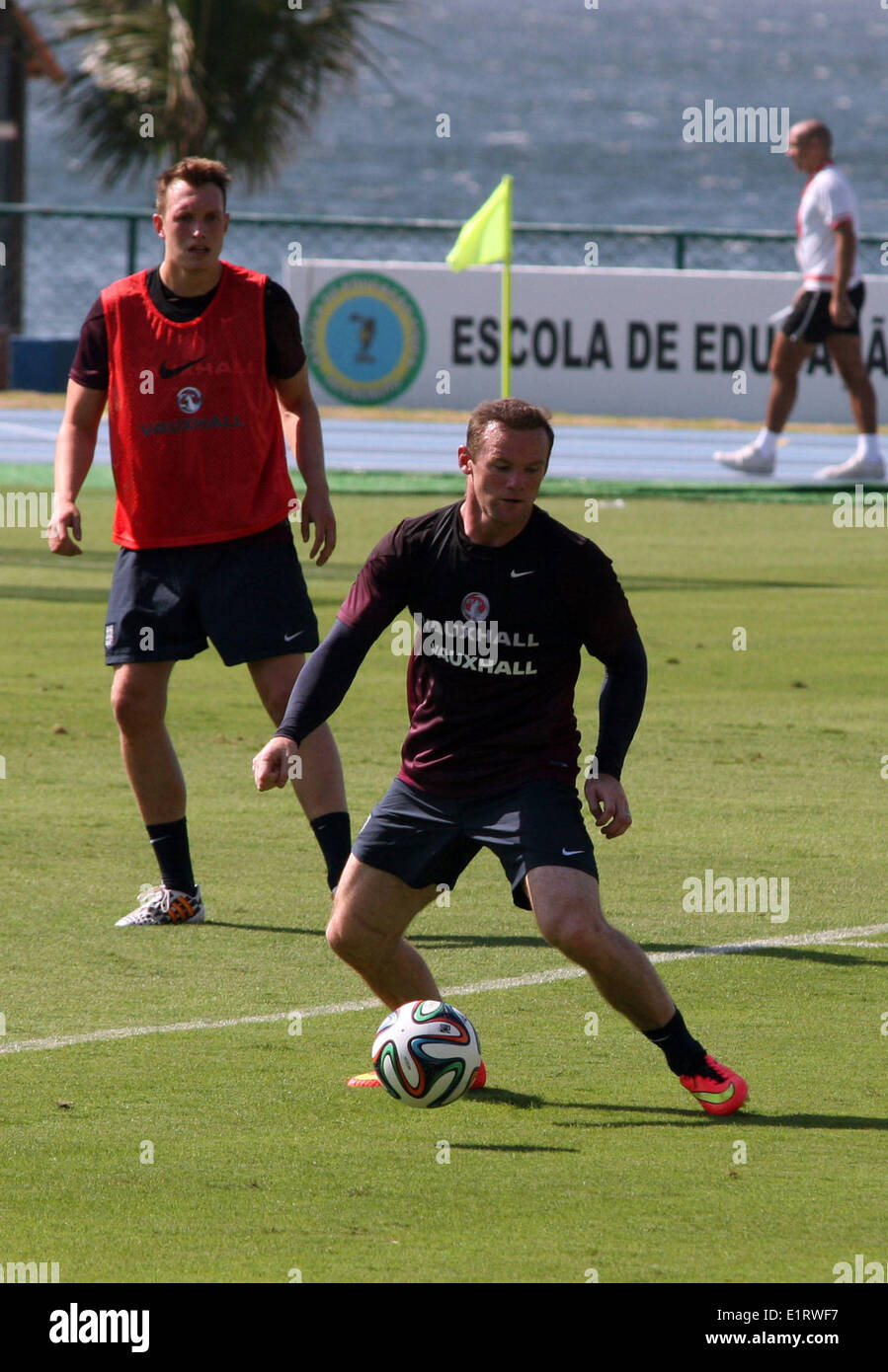 Rio de Janeiro, Brazil. 09th June, 2014. Wayne Rooney (R) and Phil Jones of England in action during a training session of the English national soccer team in Rio de Janeiro, Brazil, 09 June 2014. The FIFA World Cup will take place in Brazil from 12 June to 13 July 2014. Photo: Florian Luetticke/dpa/Alamy Live News Stock Photo