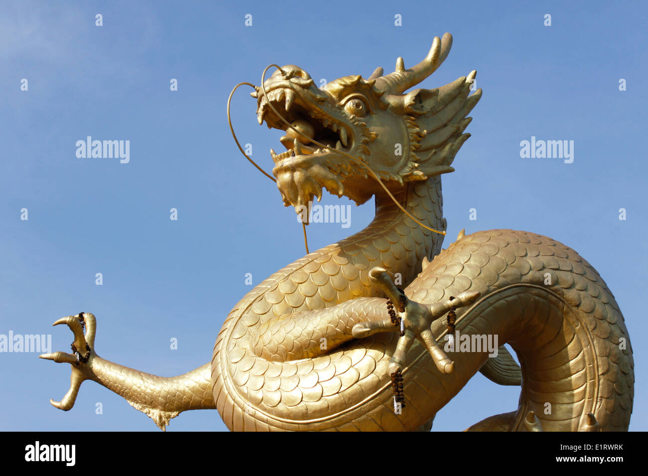 Statue of a dragoon, gold color, old town of Phuket, Thailand, Asia