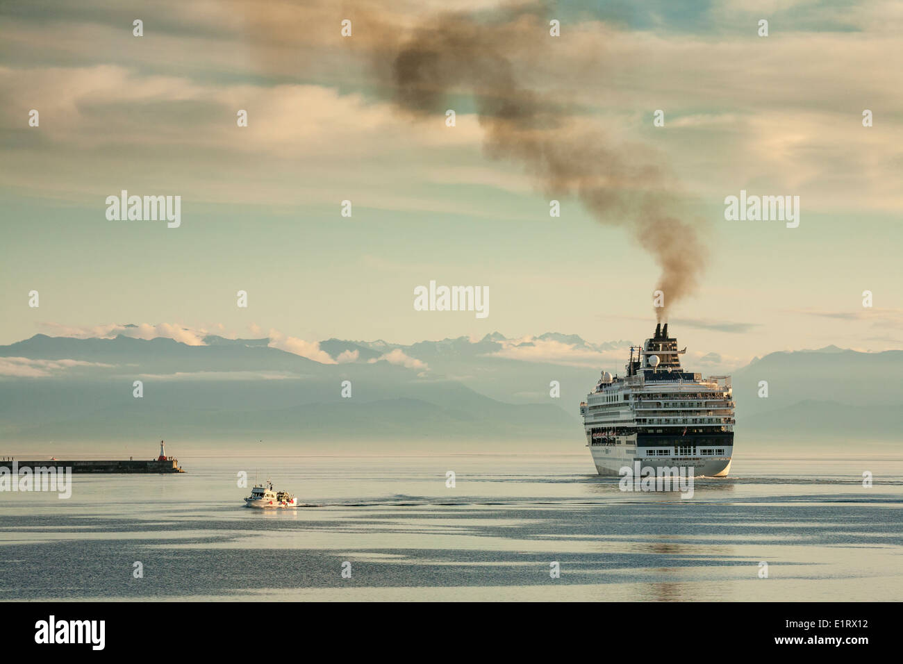 Cruise ship leaving port of Victoria with smoke pouring from funnel-Victoria, British Columbia, Canada Stock Photo