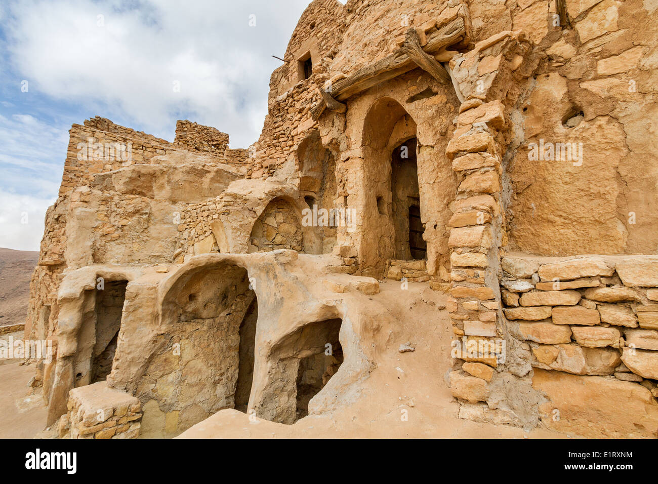 Mountainside Berber Village of Chenini, troglodyte dwellings Stock Photo