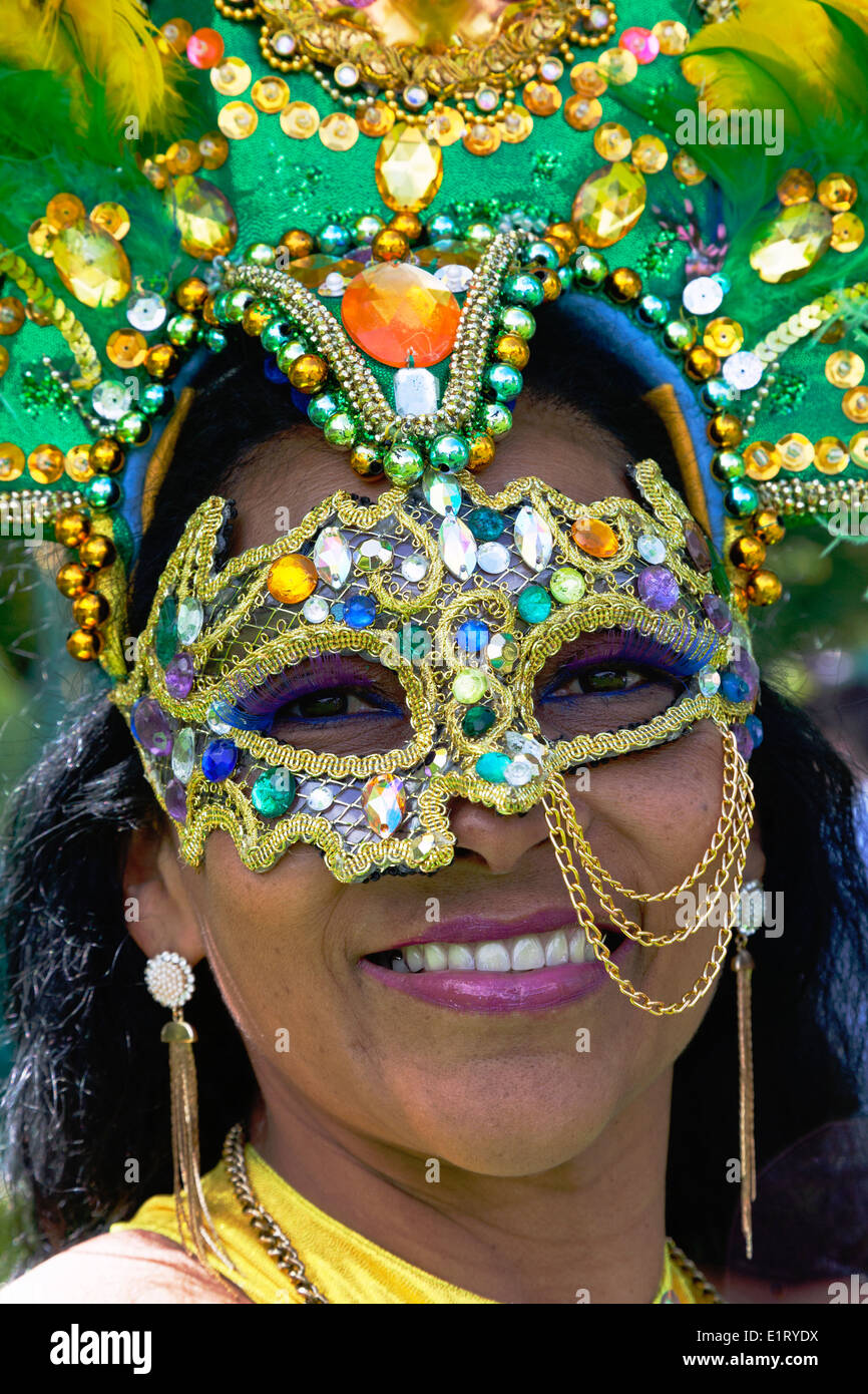 Woman dressed in traditional Brazil face mask, on parade at the West End  Festival and Mardi gras, Glasgow, Scotland, UK Stock Photo - Alamy