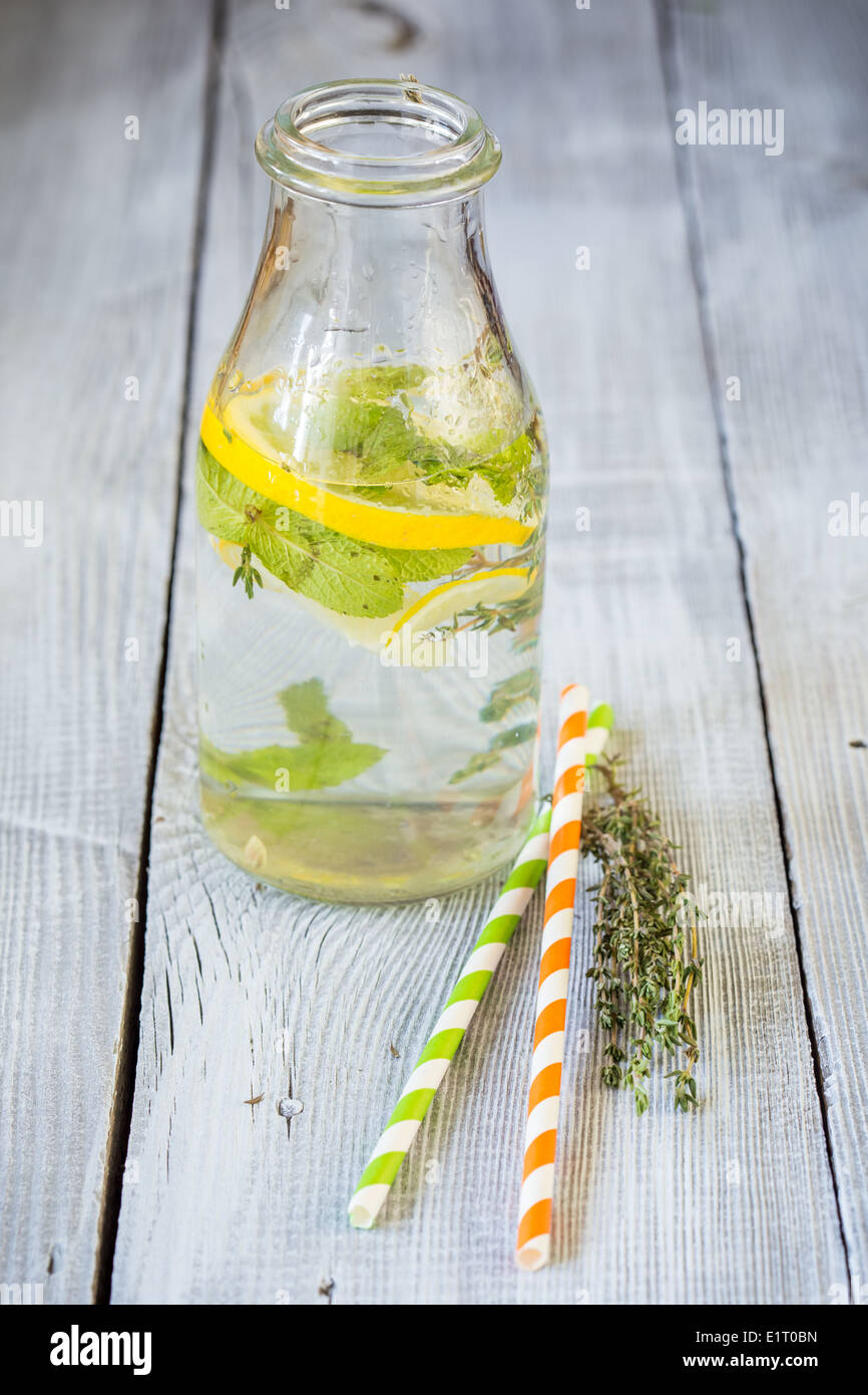 Bottle of lemonade with mint and thyme Stock Photo