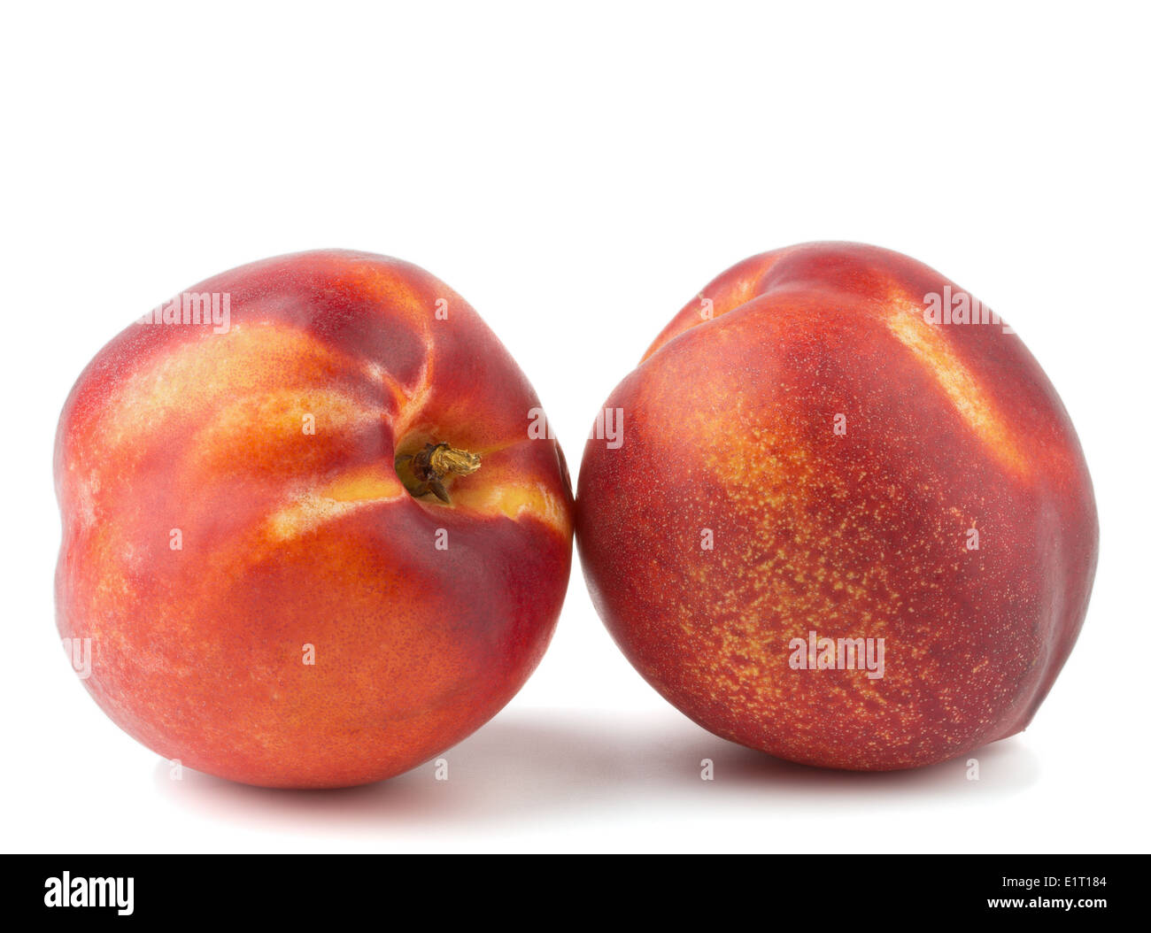 Two ripe nectarines isolated on white background Stock Photo