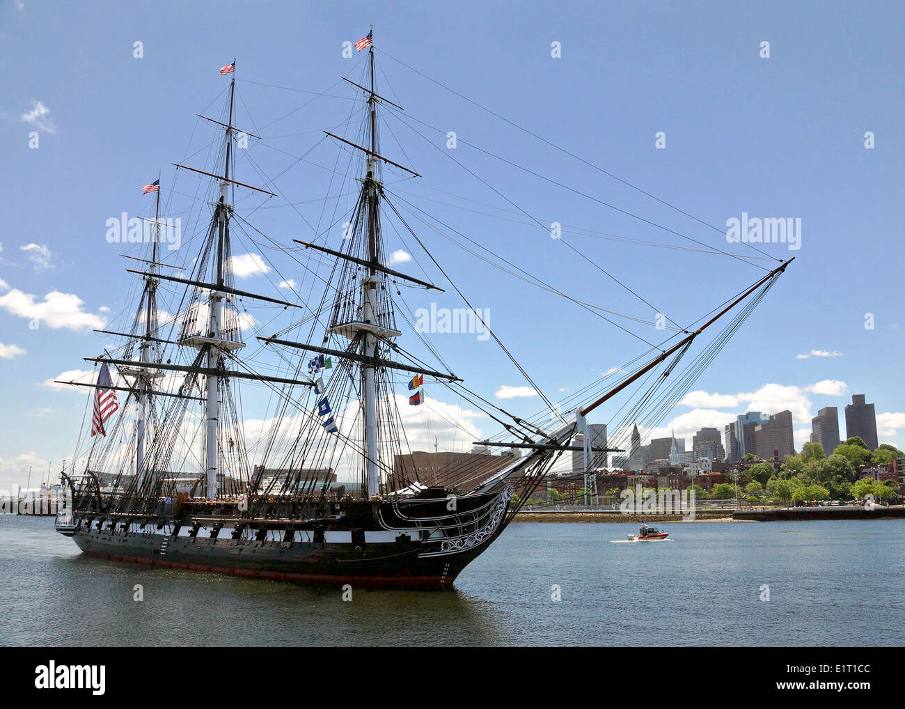 USS Constitution gets underway in Boston Harbor for her spring turnaround cruise with 400 visitors onboard June 6, 2014 in Boston, MA. Stock Photo