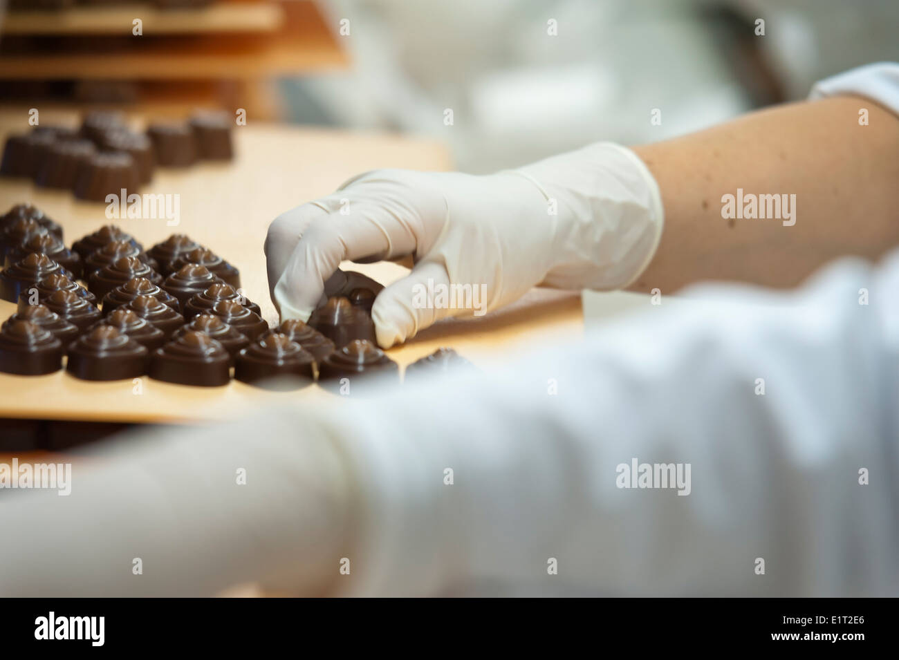 Workers at the Swiss chocolate factory of Lindt & Spruengli in Zurich / Kilchberg are sorting