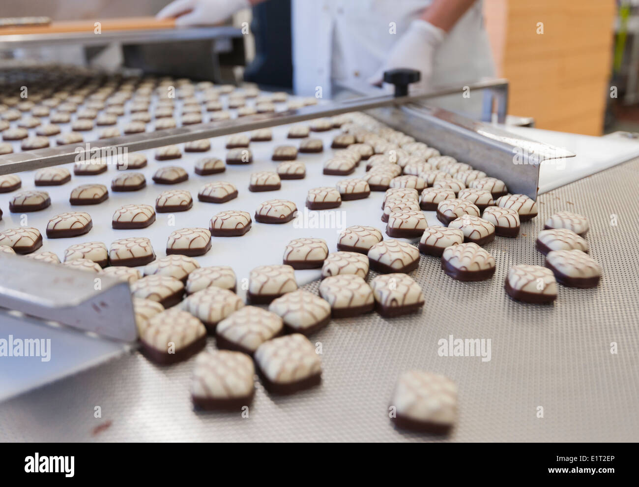 Chocolate candies in a candy machine at the Swiss chocolate factory of Lindt & Spruengli in