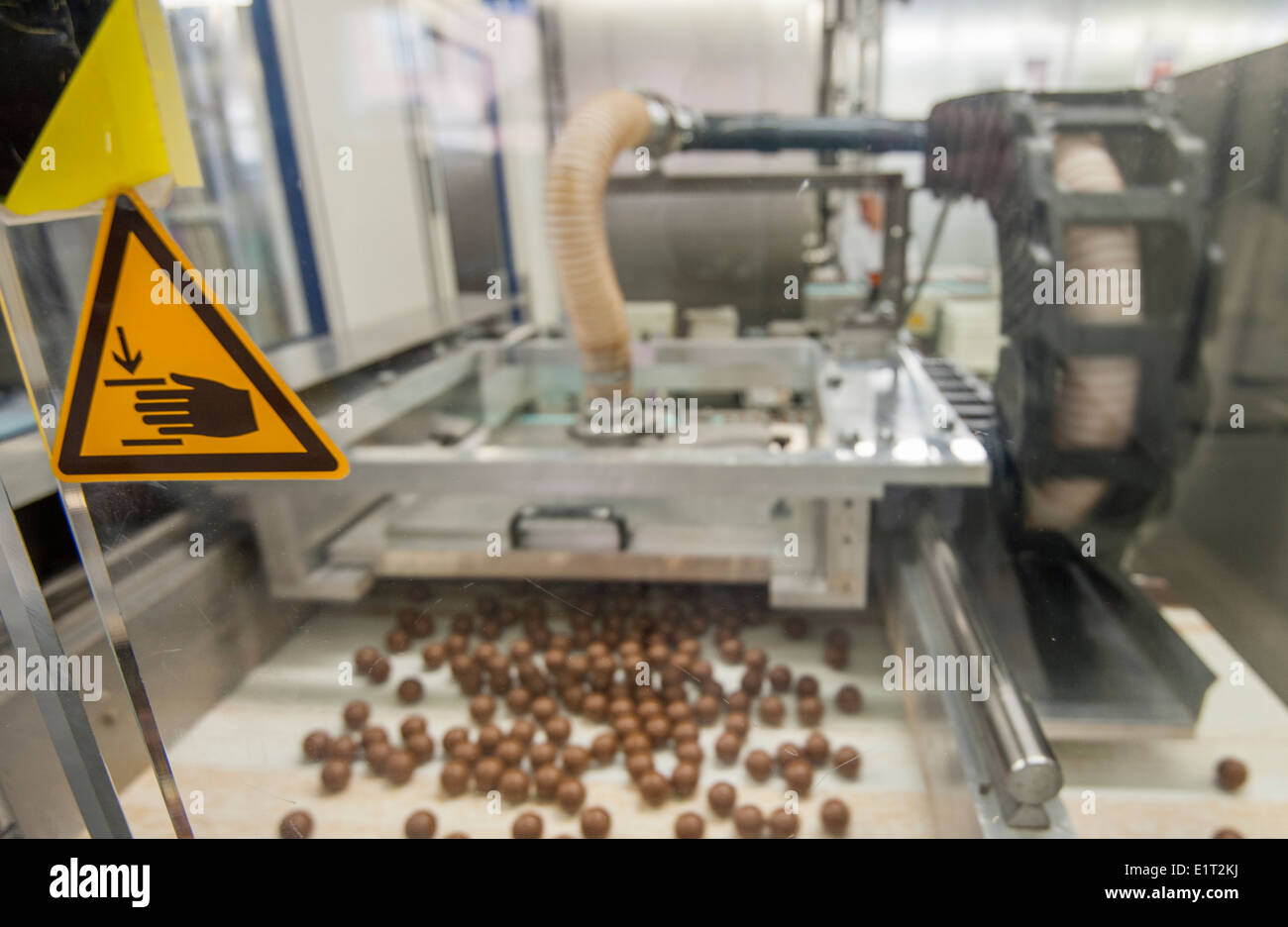 Lindor hocolate candies in a candy machine at the Swiss chocolate factory of Lindt & Spruengli in Zurich/Kilchberg Stock Photo