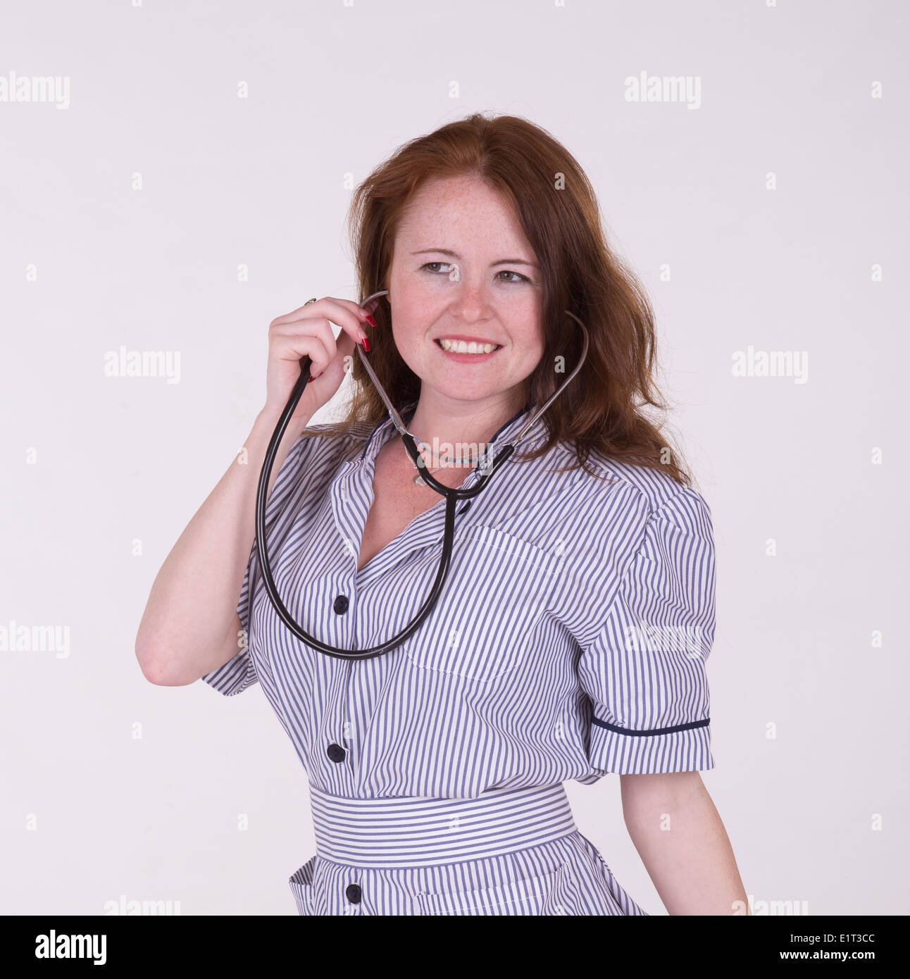 Portrait of a female medical practitioner wearing a blue stripped