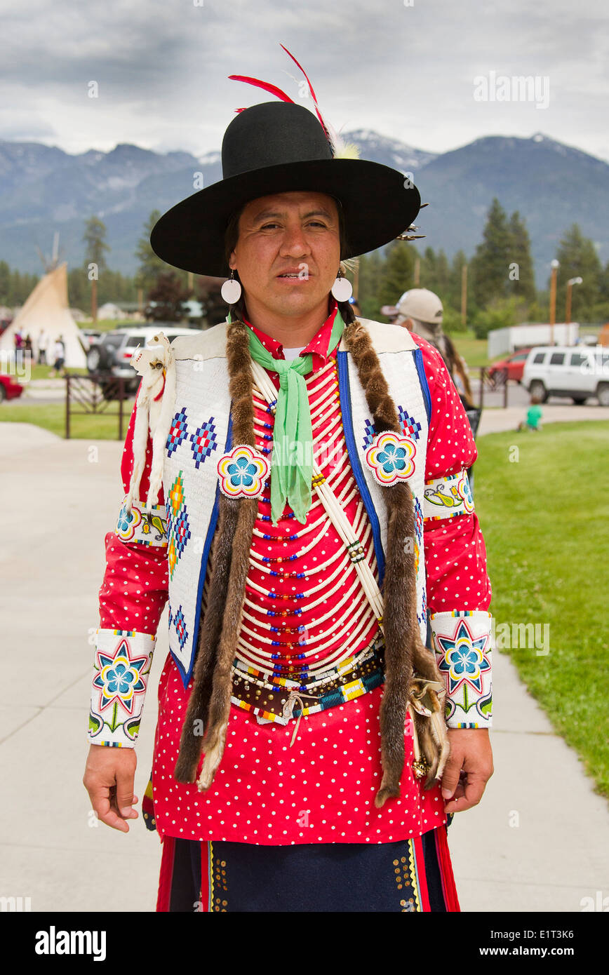 A faculty member in full regalia at the Salish Kootenai College graduation commencement June 7, 2014 in Pablo, Montana. Salish Kootenai College is a Native American tribal college which serves the Bitterroot Salish, Kootenai, and Pend d'Oreilles Native American tribes. Stock Photo