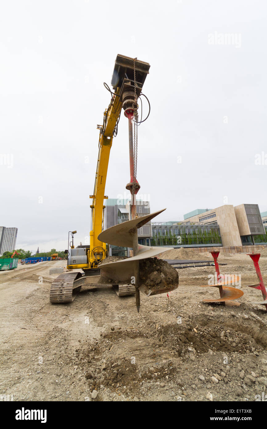 Drilling excavator with auger spiral attachment seen in Denmark Stock