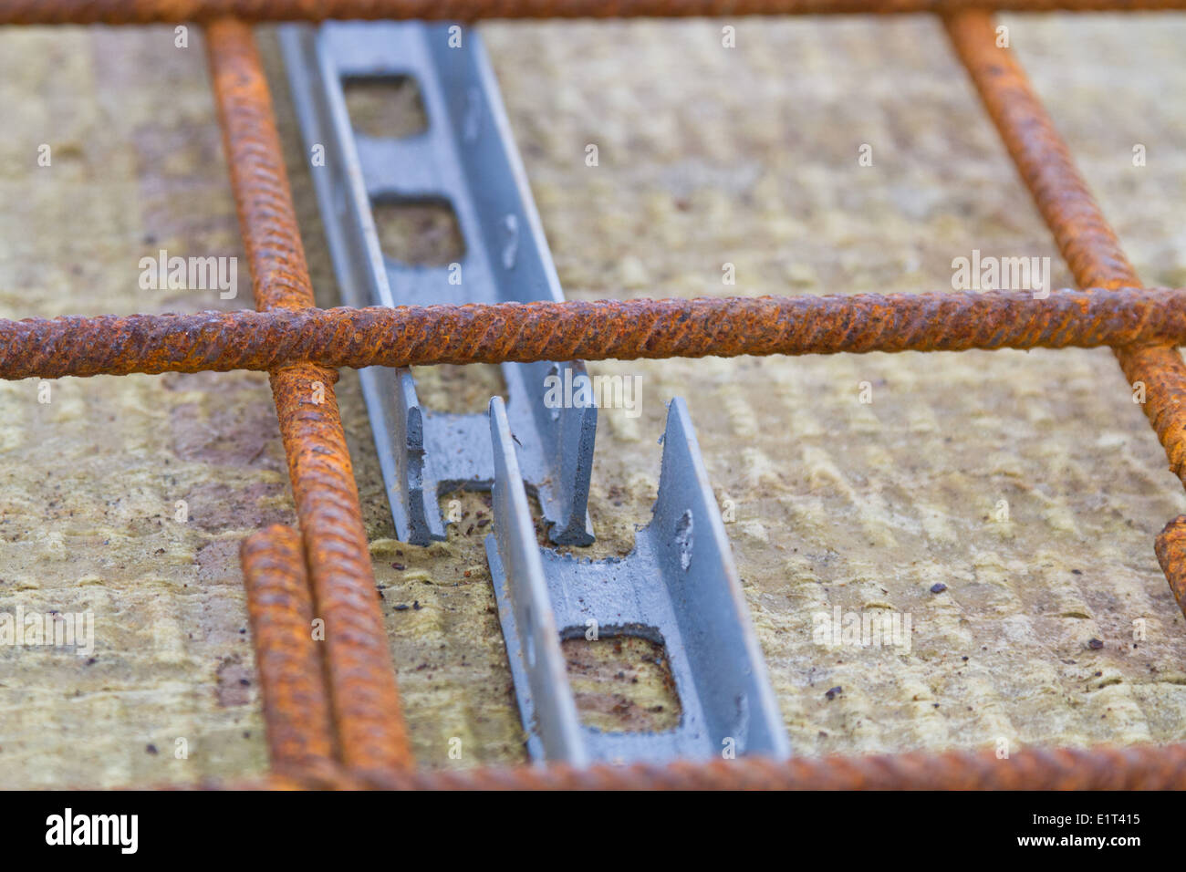 Plastic spacers used with reinforcement for concrete floors and beams