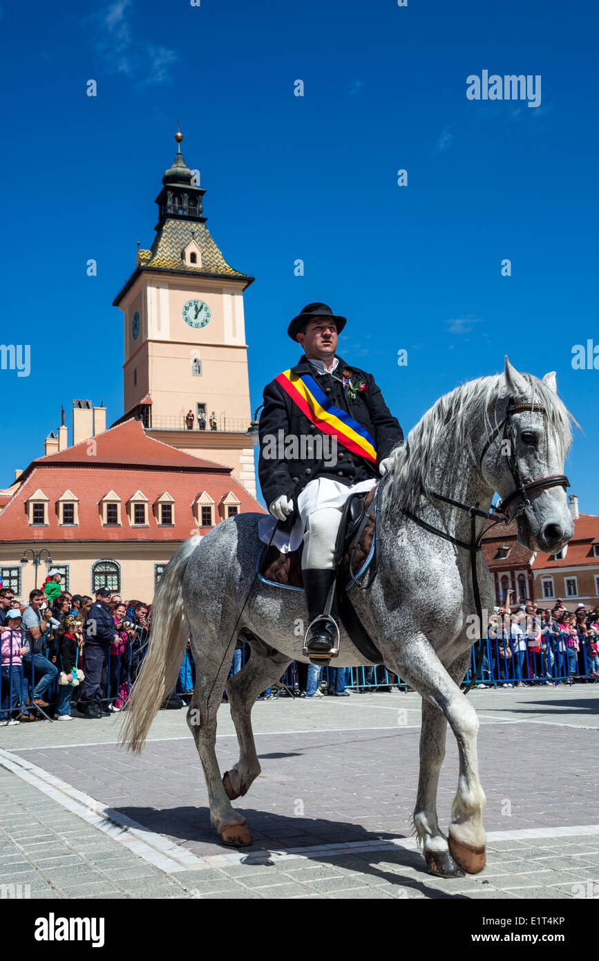 Juni Parade (after orthodox Easter). Juni are a group of romanian horsemen from Schei, Brasov, Transylvania in Romania. Stock Photo