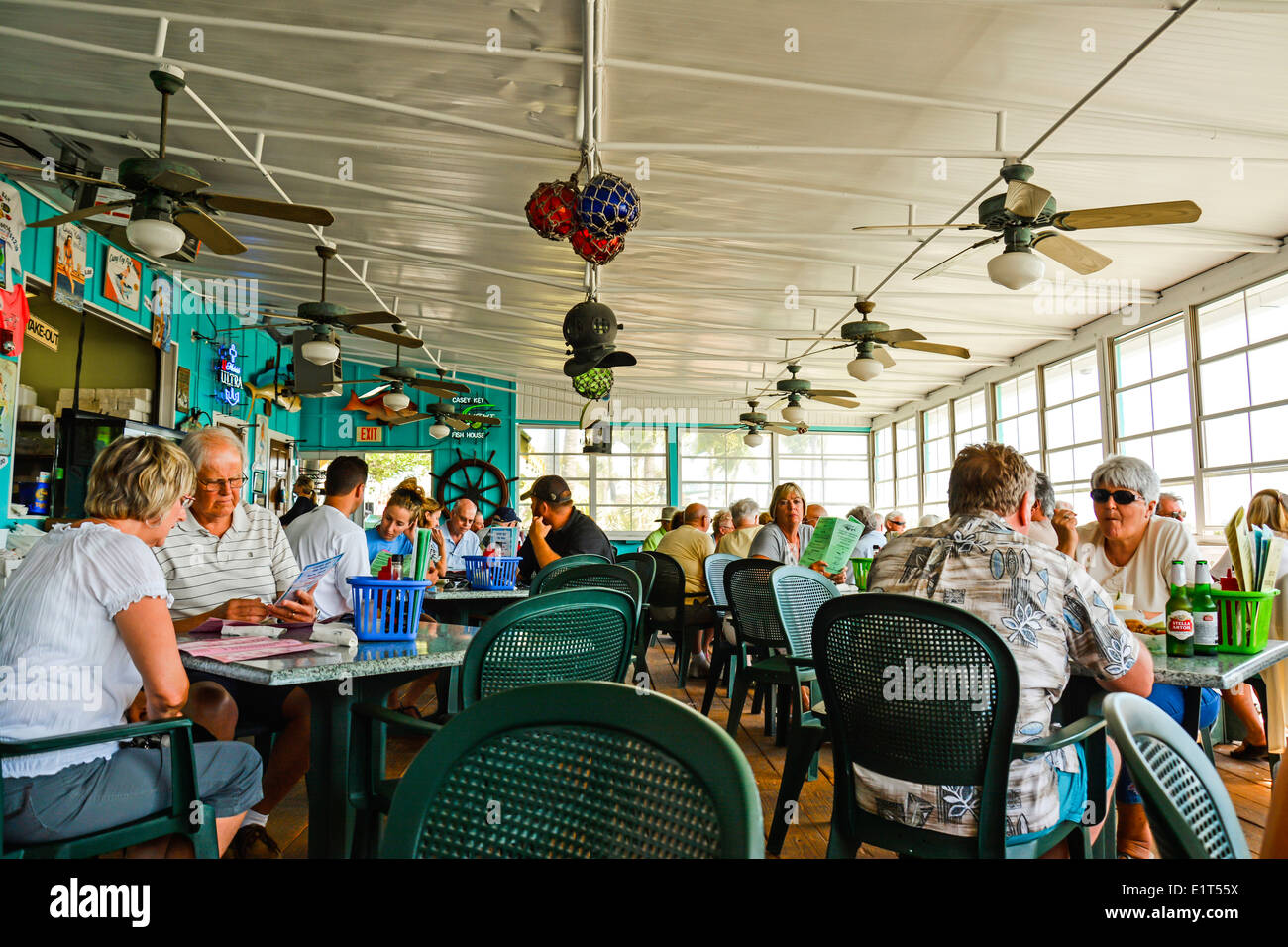 Patrons enjoying lunch at the waterfront themed Casey Key Fish House restaurant on the Gulf of Mexico, Casey Key, FL, USA Stock Photo