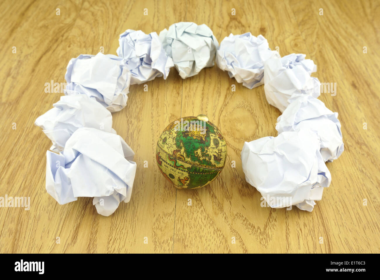 Paper ball place around the globe meaning garbage overflowing of the