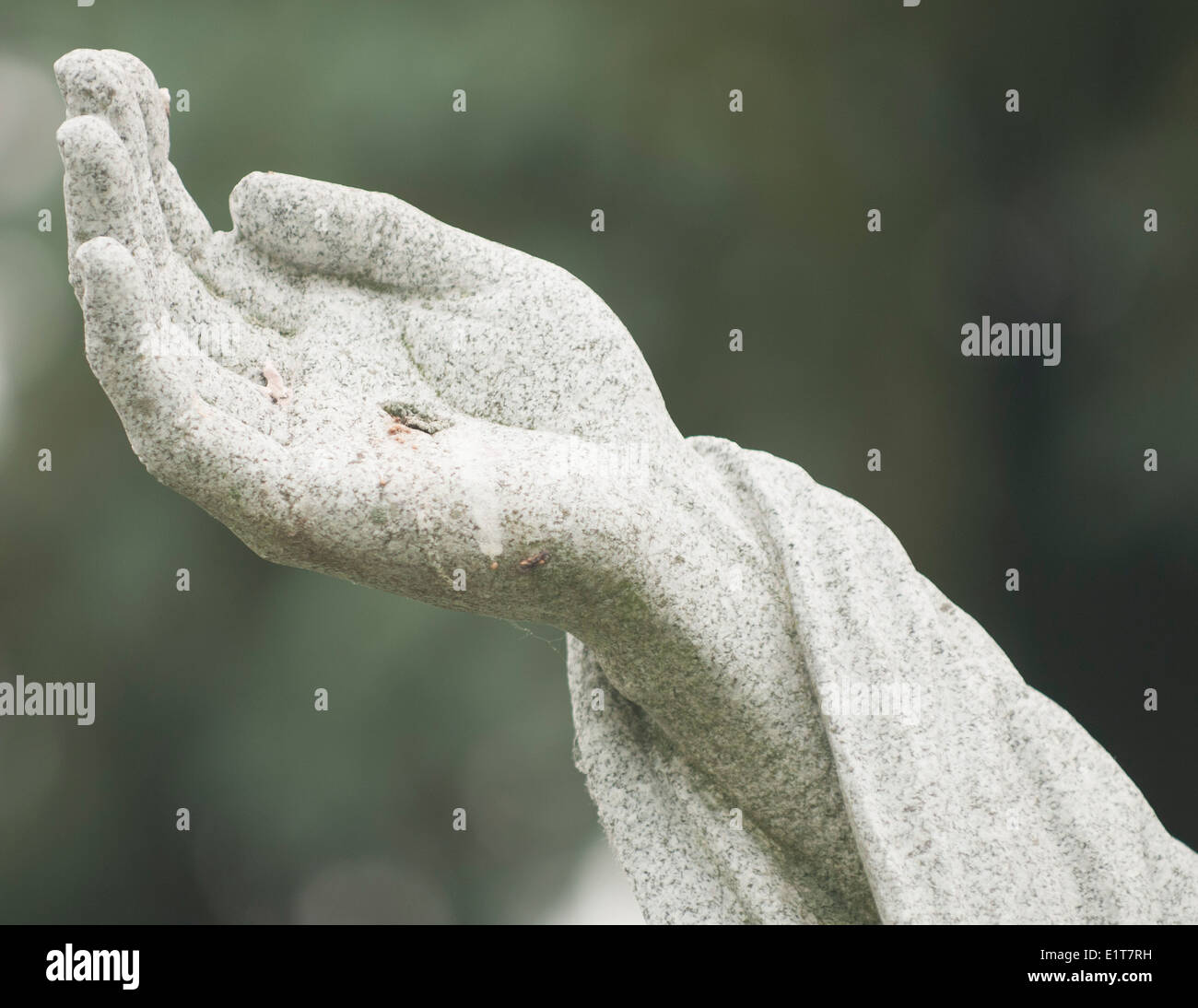 Columbus, Ohio October 06, 2014- The  nail scarred hand of a statue of Jesus Christ at St. Joseph's Cemetery. Stock Photo
