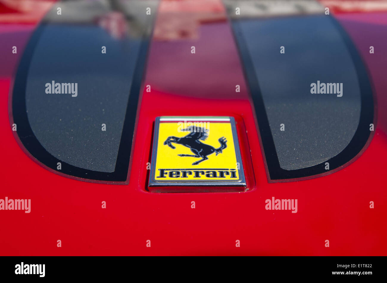 San Clemente, California, USA. 8th June, 2014. A traditional Ferrari emblem detail on the hood of a red Ferrari. The 19th Annual 2014 San Clemente Car Show featuring new and old classic and exotic cars and trucks took over the downtown along Avenida Del Mar on Sunday, June 8, 2014. The one day event brings car collectors and enthusiasts from all over southern California. Credit:  David Bro/ZUMAPRESS.com/Alamy Live News Stock Photo