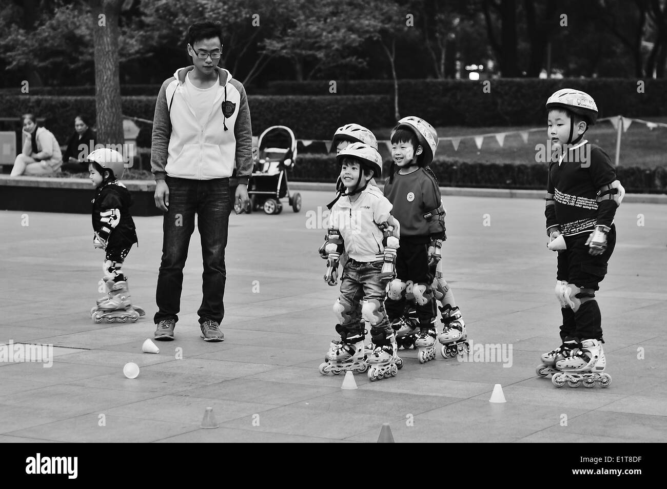 Children rollerskating in a Shanghai park Stock Photo