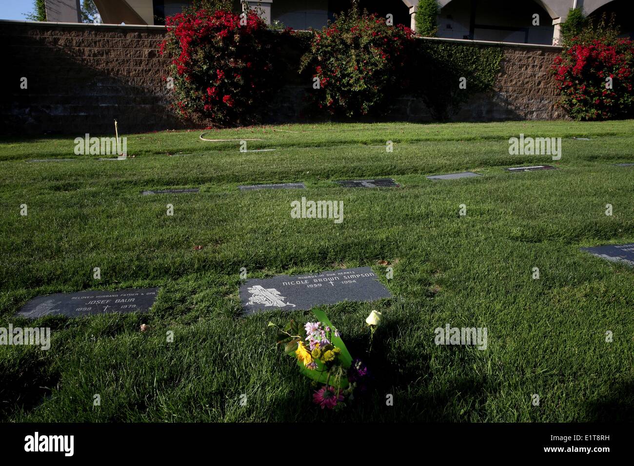 Lake Forest, California, USA. 09th June, 2014. Wilting flowers at the grave site of Nicole Brown Simpson at the Ascension Cemetery in Lake Forest, California, 20 years after her murder. At 12:10 a.m. on June 13, 1994, Nicole Brown Simpson and Ronald Goldman were found murdered outside Brown's Bundy Drive condo in the Brentwood area of Los Angeles. Suspicion quickly focused on her former husband, professional football player O. J. Simpson, who had beaten Nicole in the past and had no alibi. Credit:  ZUMA Press, Inc./Alamy Live News Stock Photo