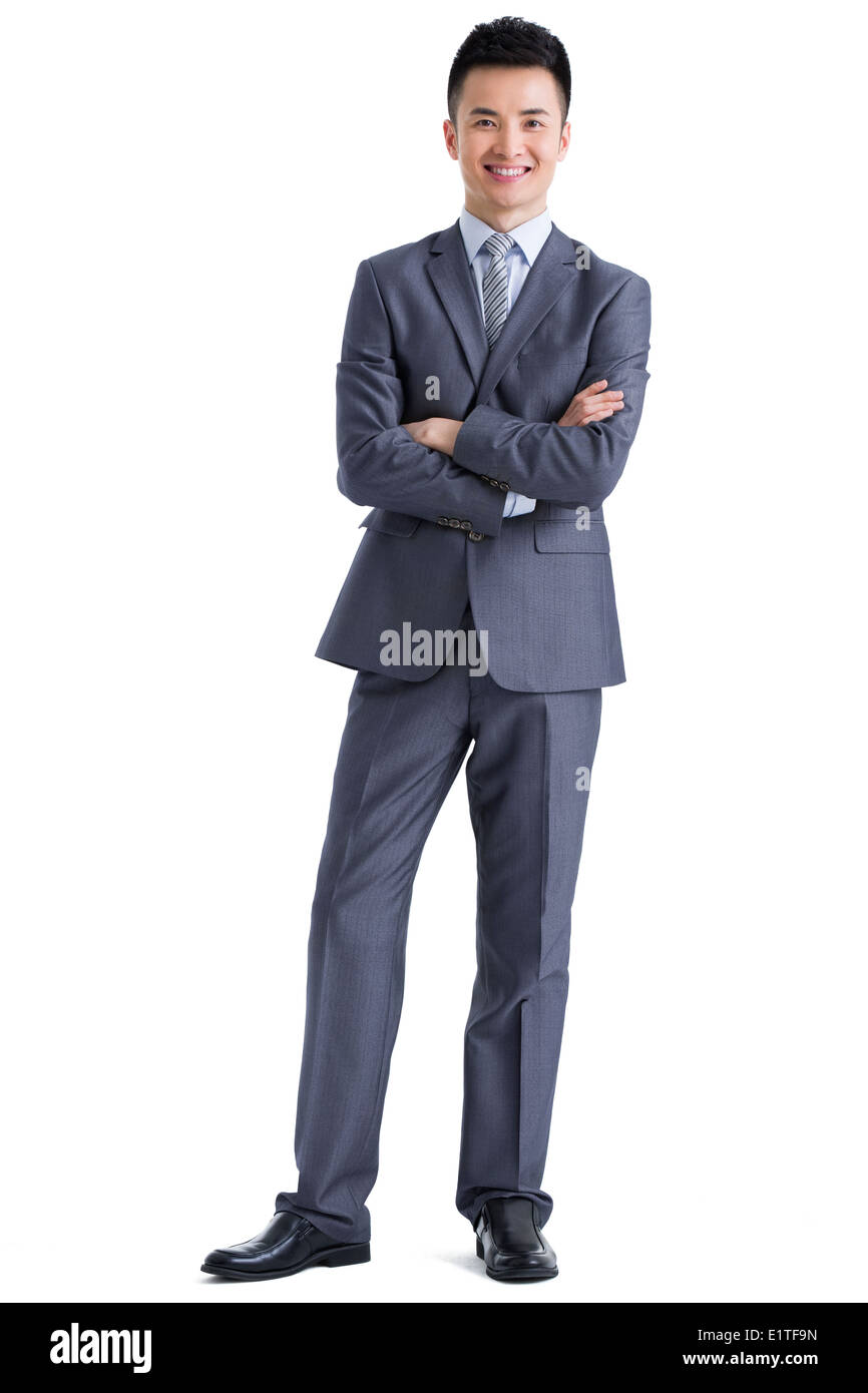 Happy businessman with arms crossed Stock Photo - Alamy