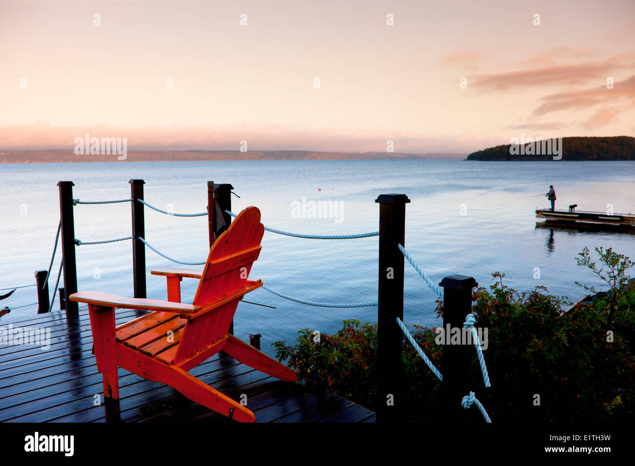Man fishing off dock, Barrachois, Bras d'or Lake, Cape Breton, Nova