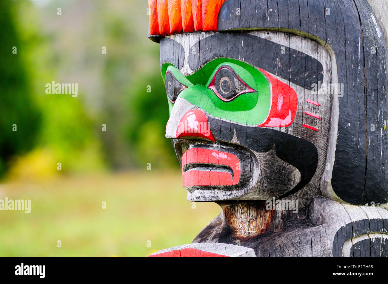 Memorial totem poles at the Namgis Burial Grounds, Alert Bay, Cormorant Island, near Vancouver Island in British Columbia. Stock Photo