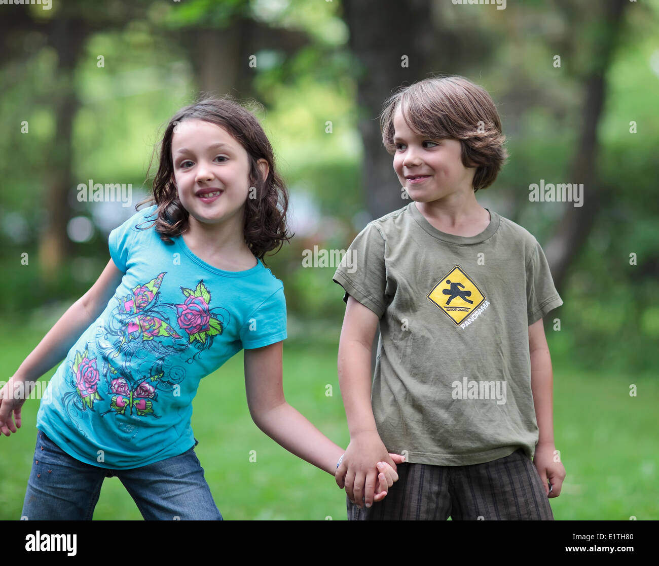 Two teen boys holding hands hi-res stock photography and images - Alamy