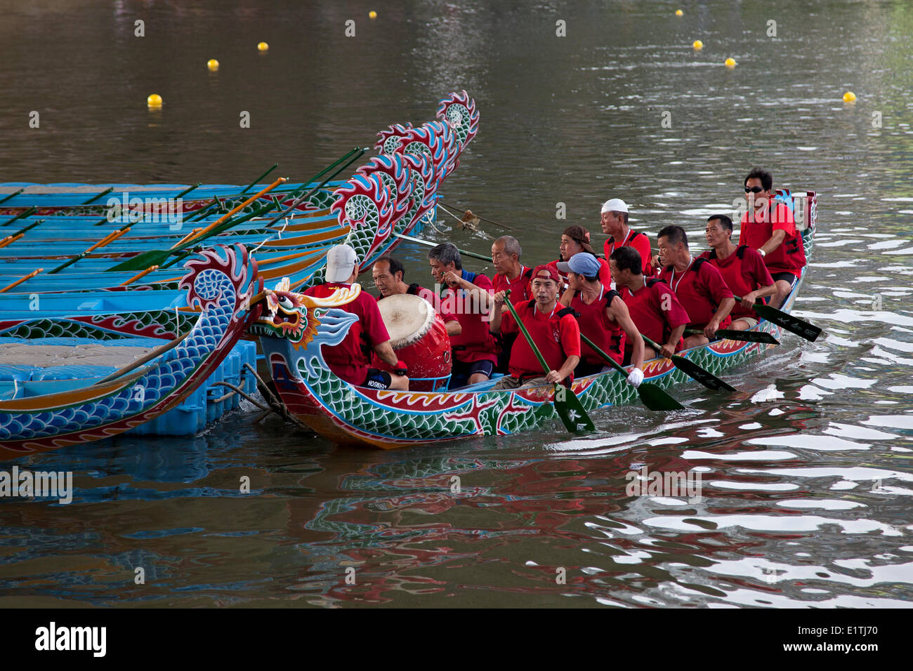 Small troubles of a dragon boat heading to the start at the annual Dragon Boat Festival in Taipei, Taiwan, Saturday, May 31, 2014. Dragon boat races are held across the Southeast Asia for more than 2000 years to remember Qu Yuan, an ancient Chinese poet a Stock Photo