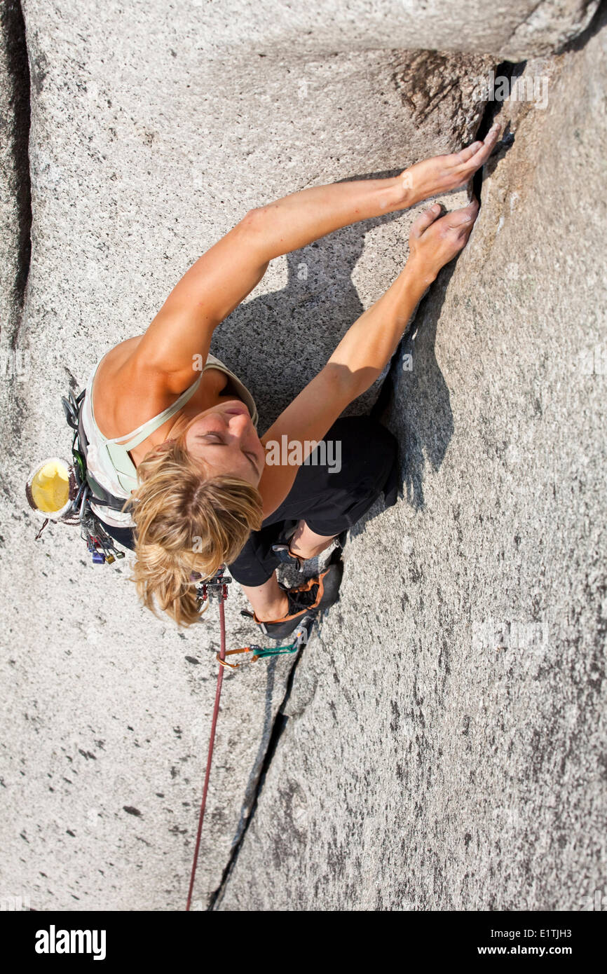 A strong female climber climbing Crescent Crack 10d, Squamish, BC Stock Photo