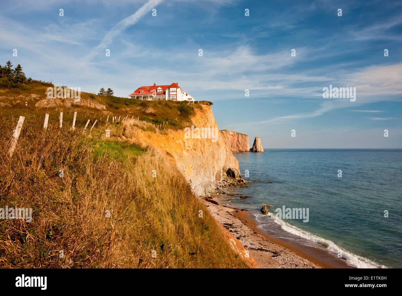 House on cliff, and Perce Rock, Perce, Quebec, Canada Stock Photo Alamy