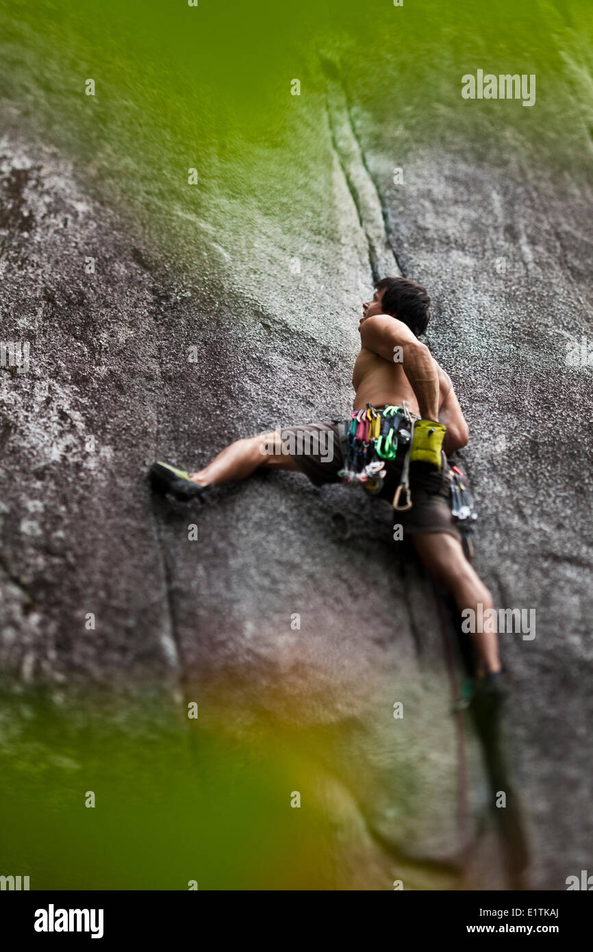 A man rockclimbing S-M's Delight 10b, Squamish, BC Stock Photo