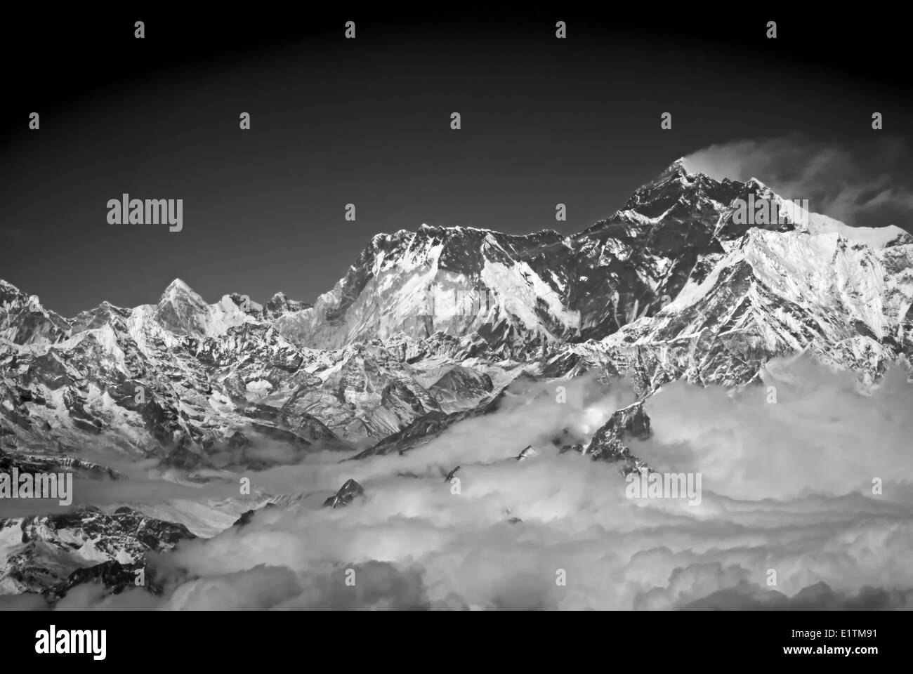 Mt Everest with its customary plume of cloud blowing off the summit