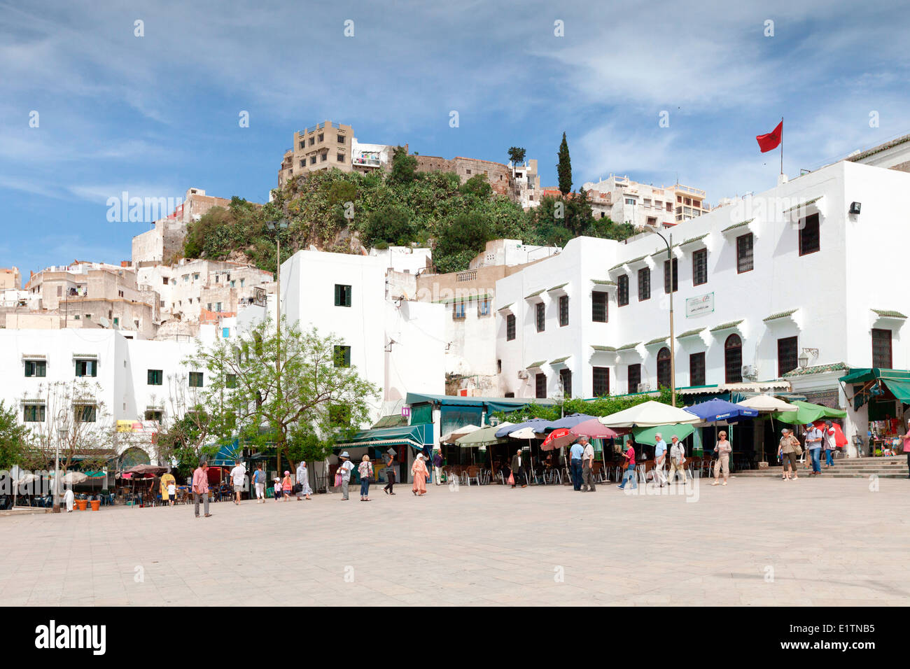 View of the local cafes and restaurants in the main square at the hilltop town of Moulay Idriss near  Meknes in  Morocco. Stock Photo