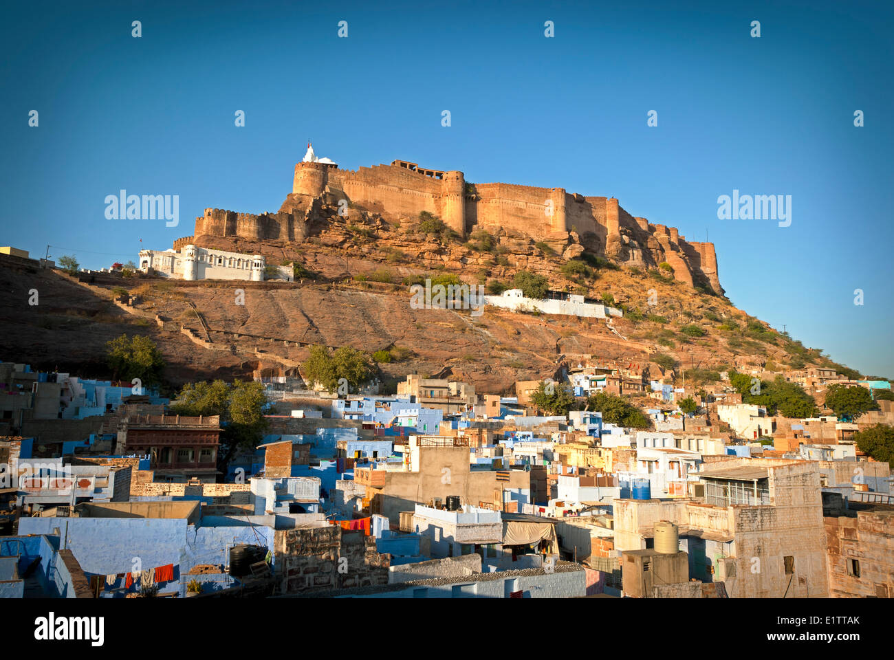 Mehrangarh fort at sunset sits above the blue city jodhpur hi-res stock ...