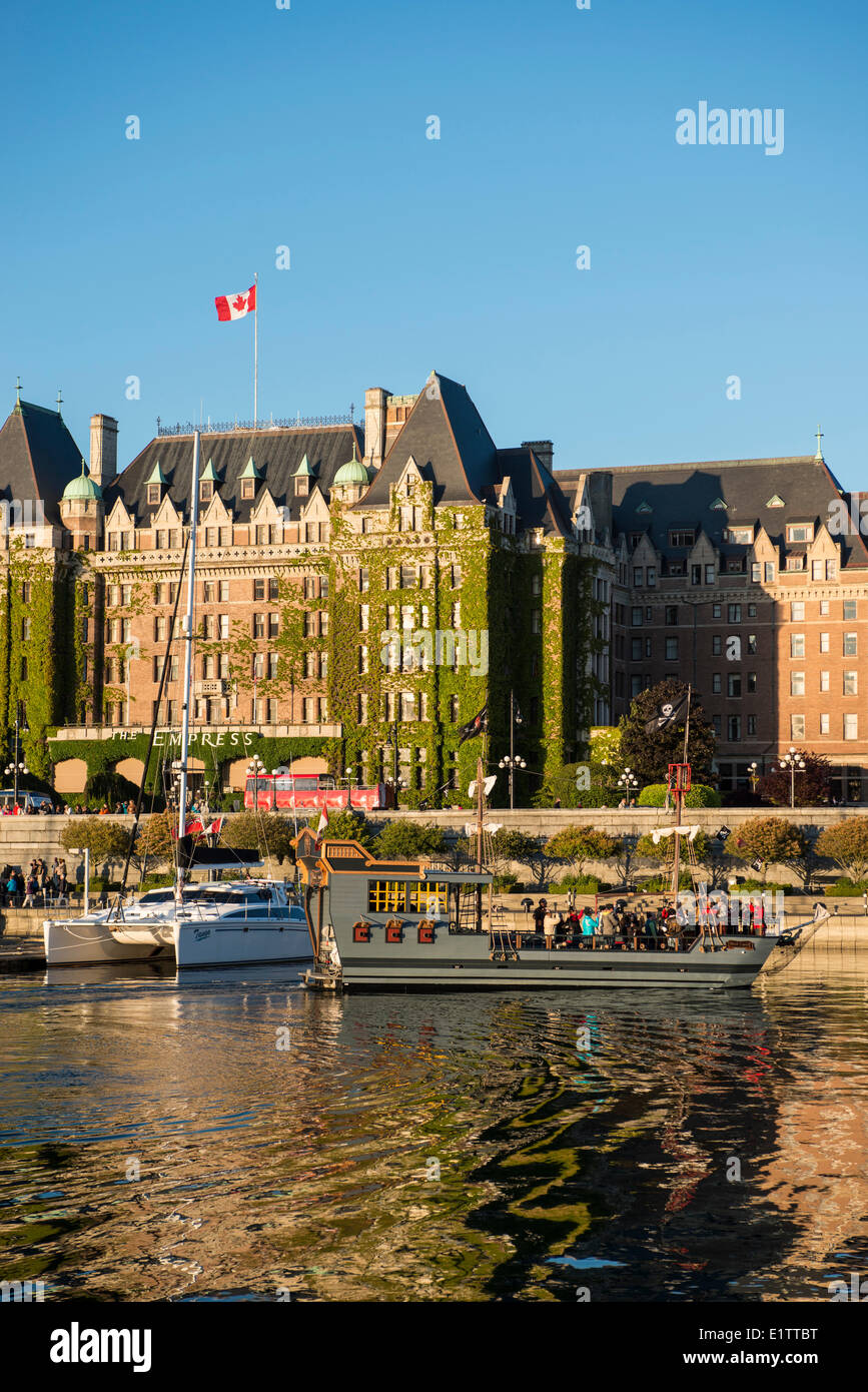 Charter boat with visitors and Empress Hotel, Inner Harbour, Victoria, British Columbia, Canada Stock Photo