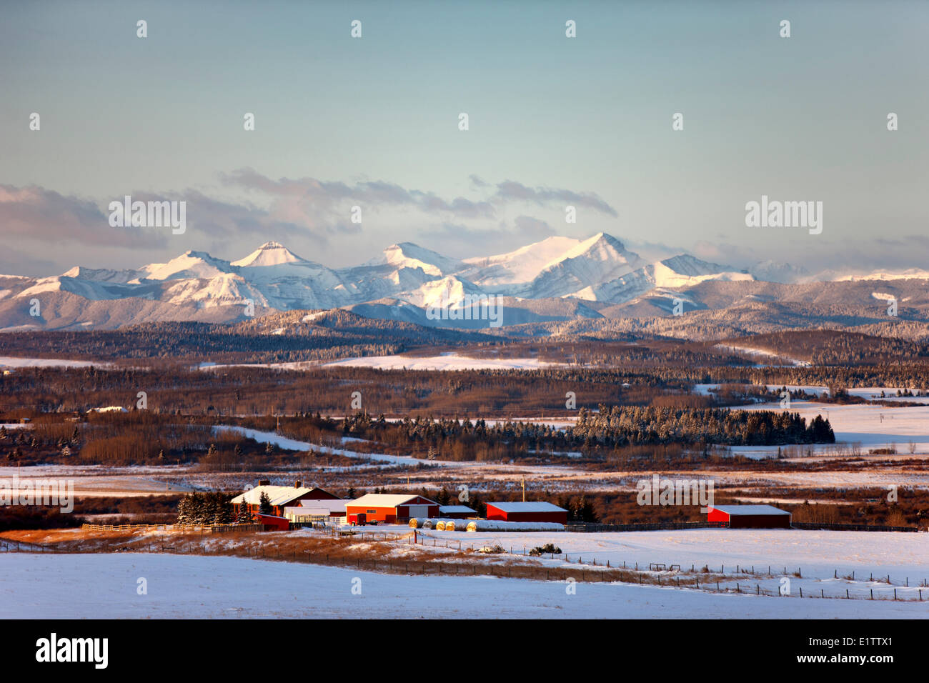 View Rocky Mountains as sun rises, Range Road 33,  Alberta, Canada Stock Photo