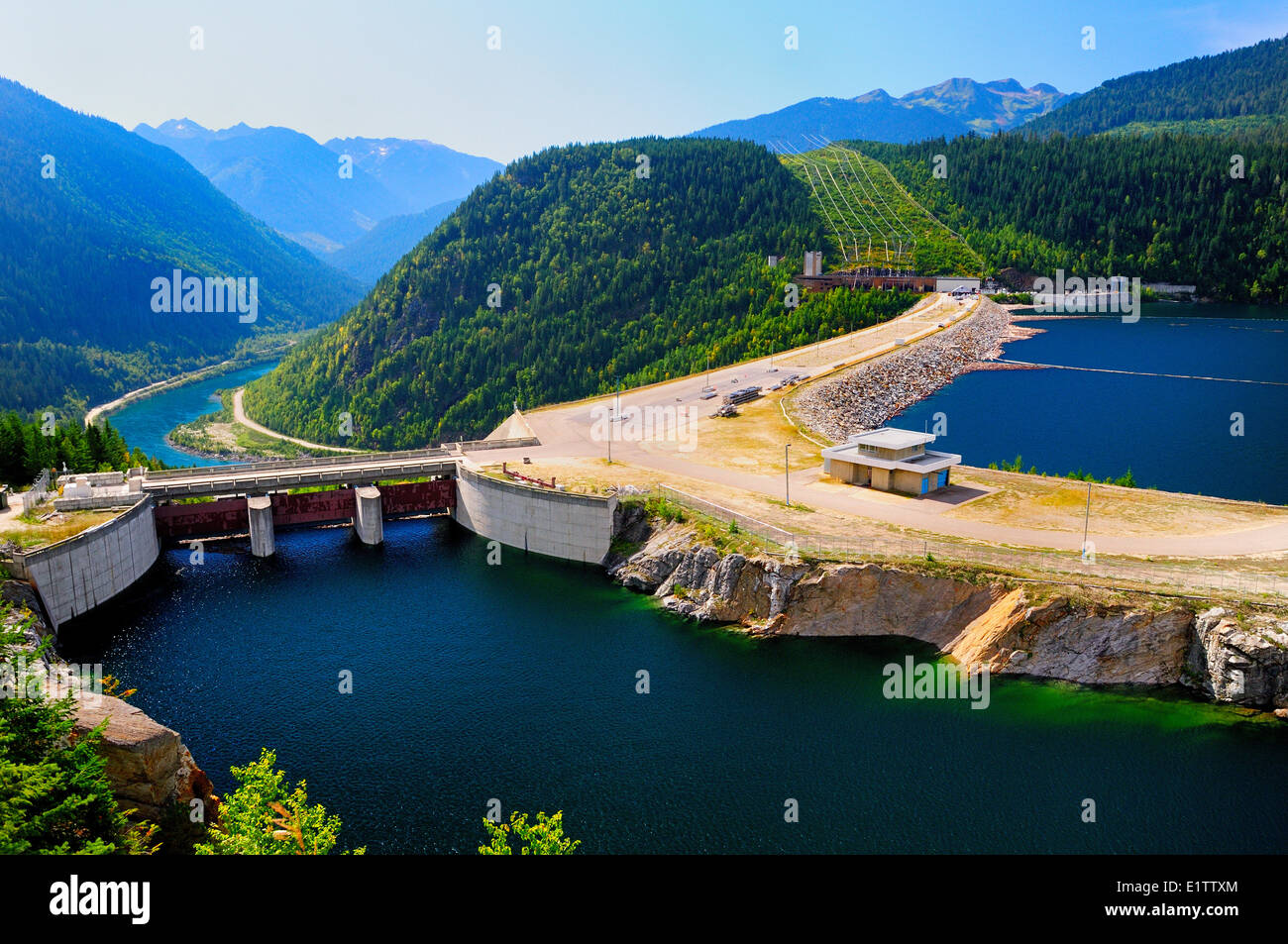 The Mica Dam spans the Columbia River at the north end of Lake Revelstoke near Revelstoke, BC. Stock Photo