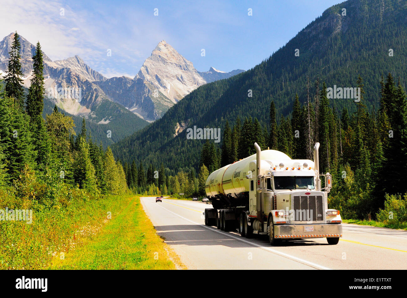 A Gibsons truck hauls propane along the Trans Canada Highway in Glacier National Park Stock Photo