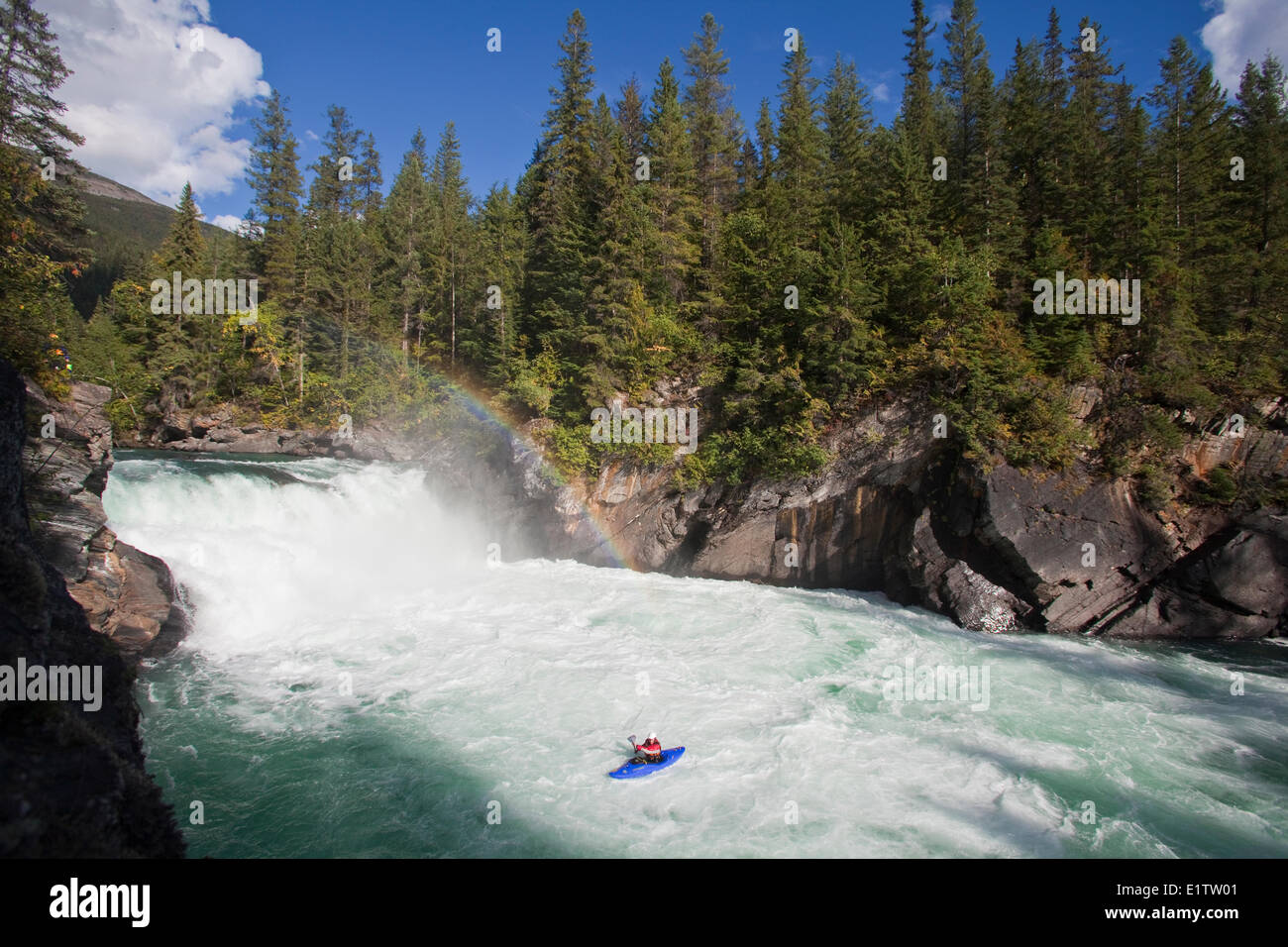 A man kayaks Overlander Falls, Fraser River, Mt Robson Provincial Park, BC Stock Photo