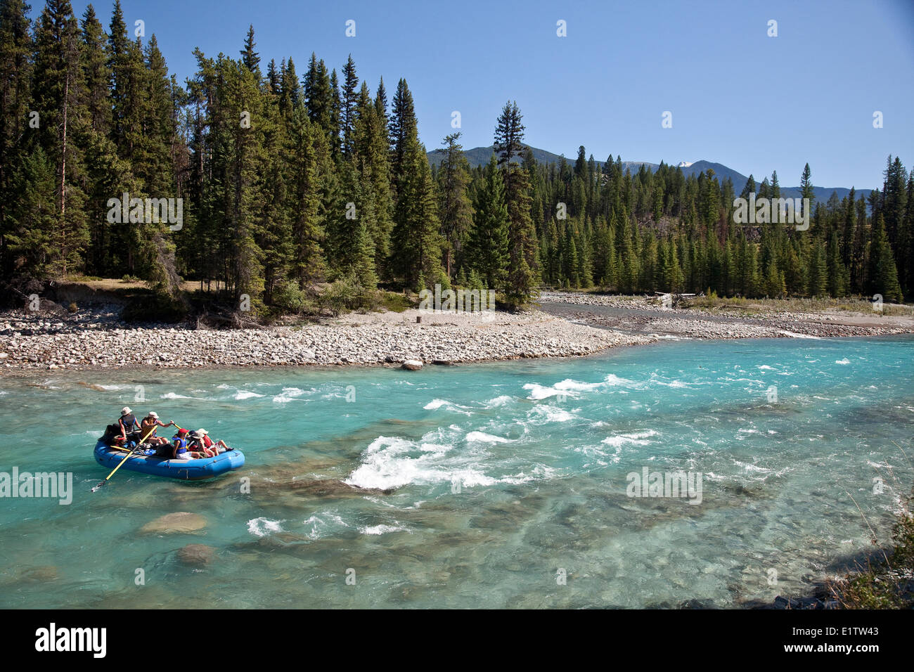 Family enjoy raft trip on Kootenay River, Kootenay National Park, BC, Canada. Stock Photo