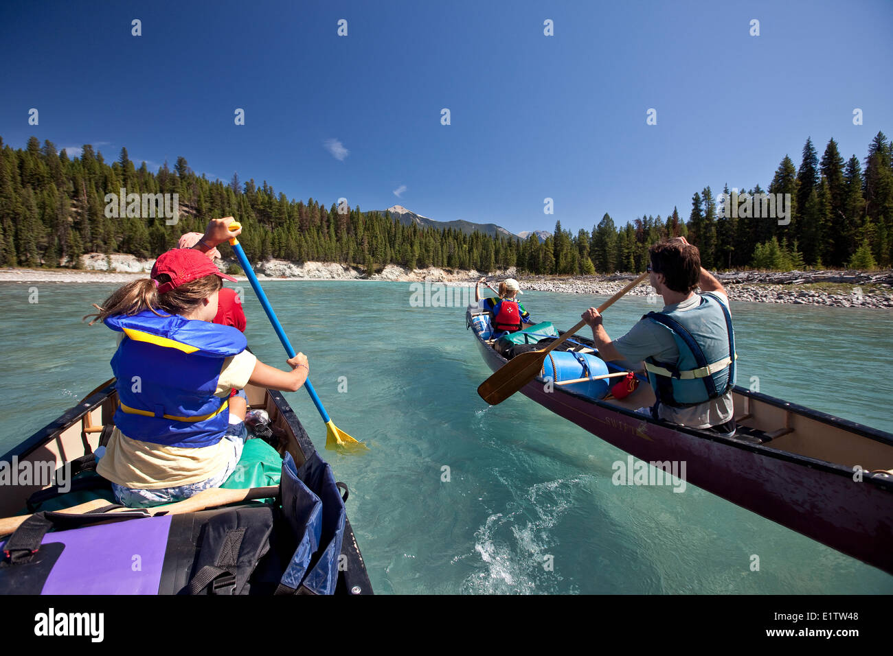 Two families paddle canoes on Kootenay River, Kootenay National Park, BC, Canada Stock Photo Alamy
