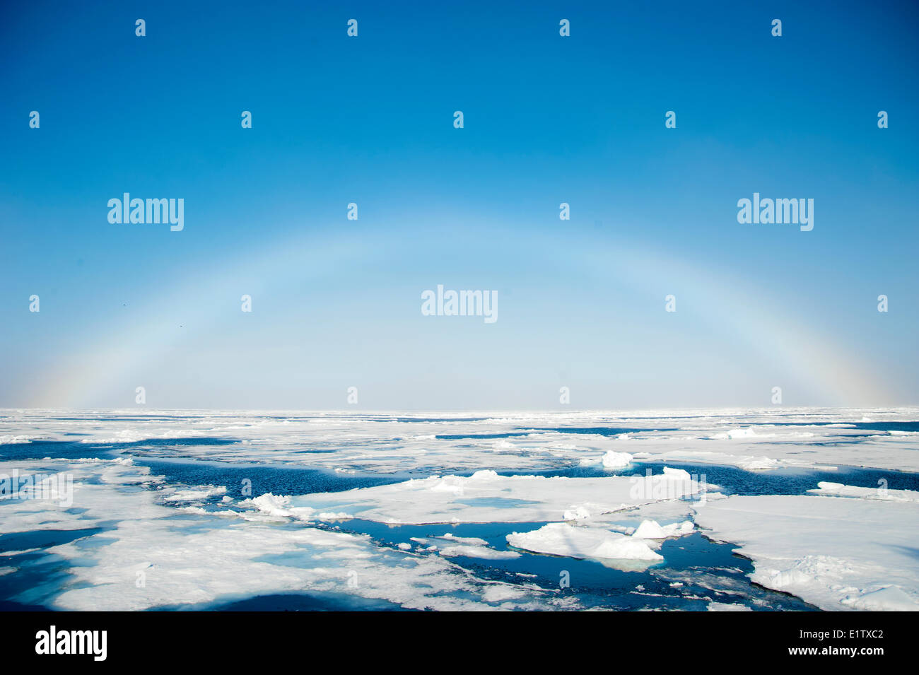 Rainbow over the pack ice, Svalbard Archipelago, Norwegian Arctic Stock Photo