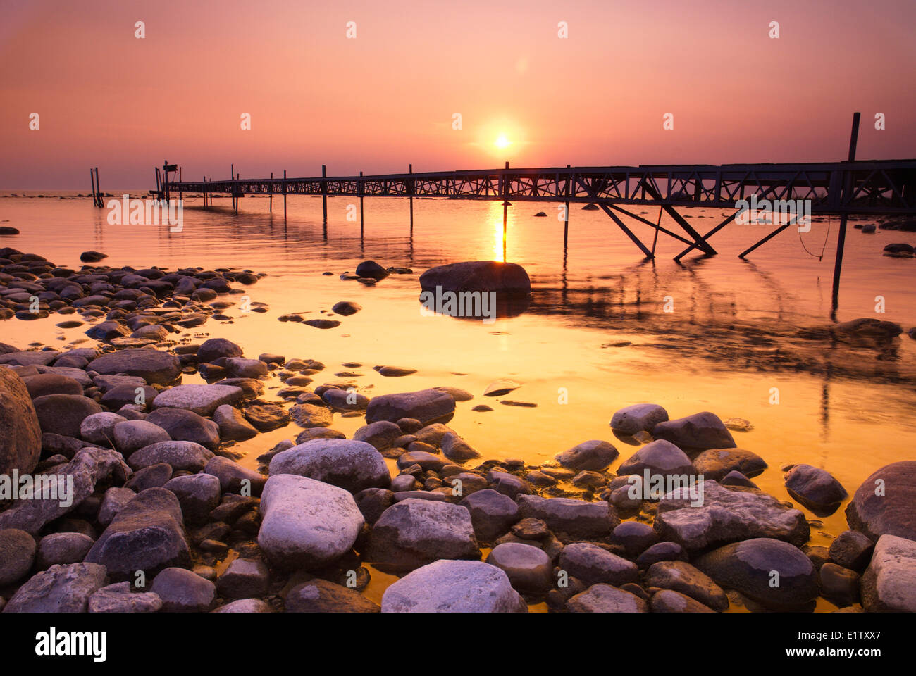 Pier with sunset near Woodland Beach, Bay, Ontario Stock Photo