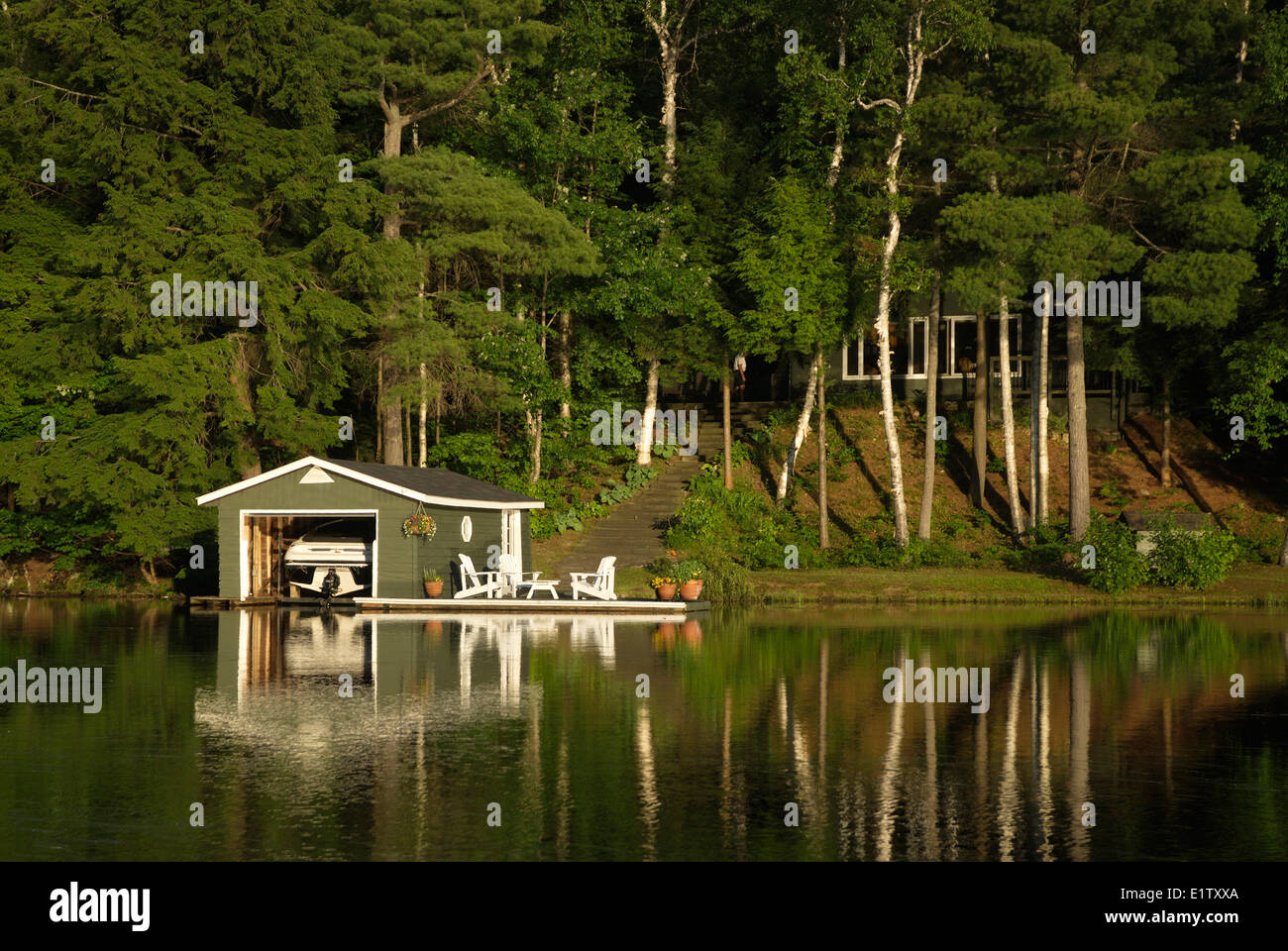 Cottage and boat house on lake of bays hires stock photography and
