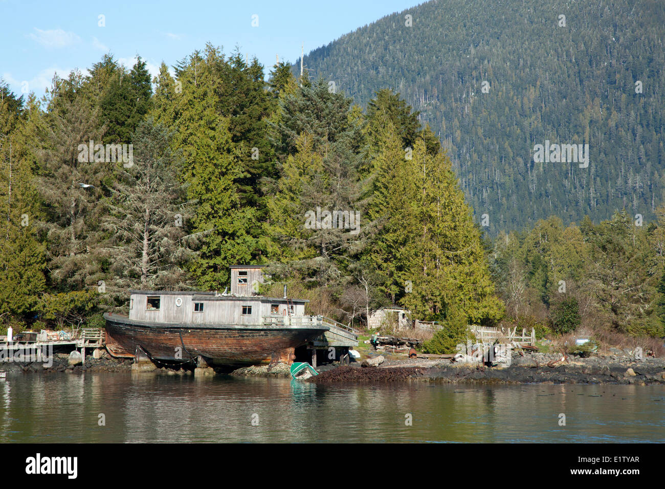 A float home house boat on an island near Tofino British Columbia Canada on Vancouver Island in Clayoquot Sound Biosphere Stock Photo
