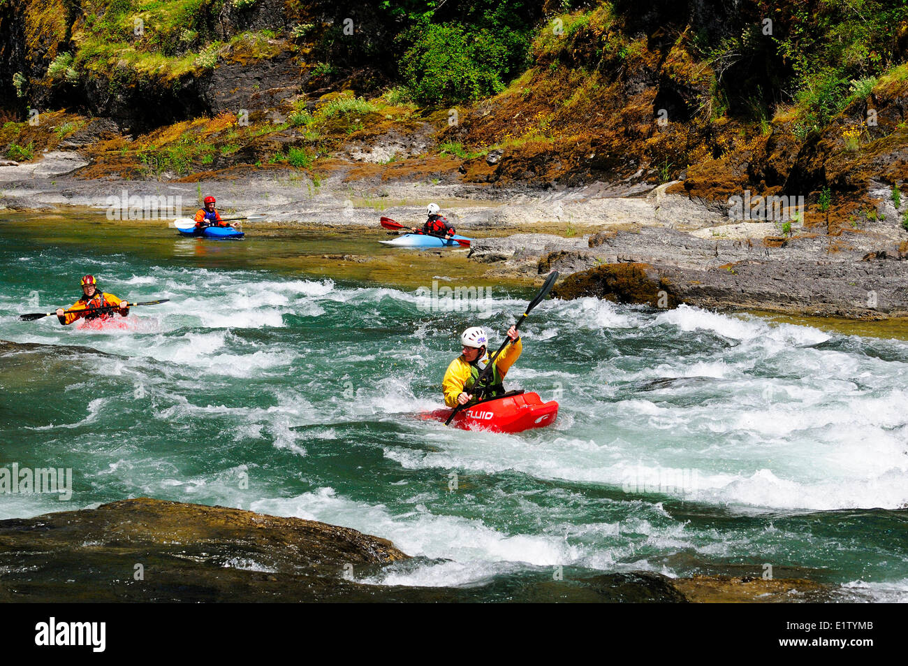 Kayakers near Horseshoe Bend on the Cowichan River near Lake Cowichan, BC. Stock Photo