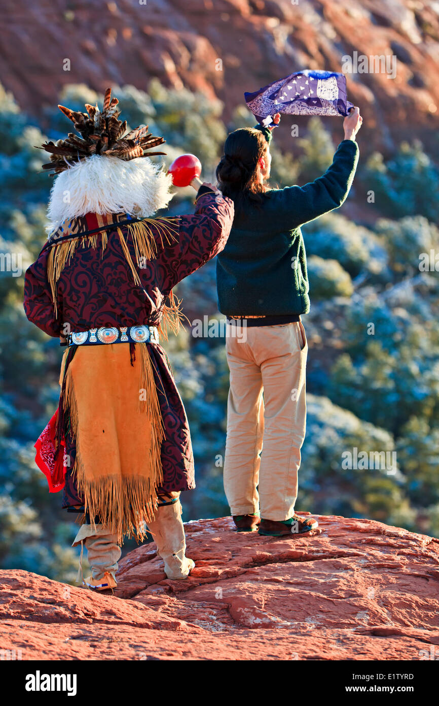 Native american (American Indian) celebrating the sunrise ceremony on top of a Mesa near Sedona